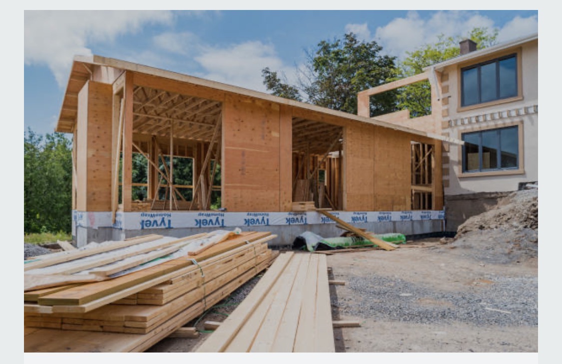 House framing in progress: Wall framing, sheathing & construction materials onsite